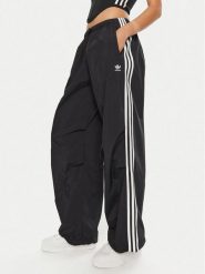 Adidas Spodnie dresowe 3-Stripes Woven Parachute IY7251 Czarny Loose Fit. Czarne spodnie dresowe damskie Adidas, xl, bez wzorów, z dresówki. Za 279.99 zł.
