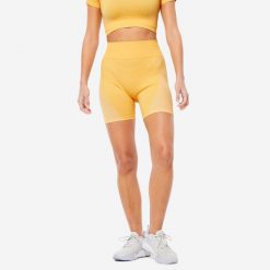 Spodenki fitness damskie Domyos krótkie. Żółte szorty sportowe damskie DOMYOS, l, bez wzorów, z materiału, sportowe, z podwyższonym stanem, na fitness i siłownię. Za 59.99 zł.