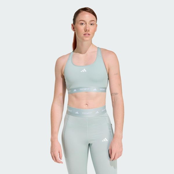 Biustonosz TECHFIT. Zielone biustonosze Adidas, bez wzorów, z materiału, na fitness i siłownię. Za 179.00 zł.