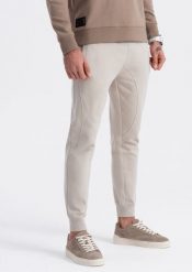 Ombre Spodnie męskie dresowe typu jogger - jasnobeżowe V1 OM-PABS-0173 S. Brązowe spodnie sportowe męskie Ombre, m, bez wzorów, z dresówki. Za 89.99 zł.