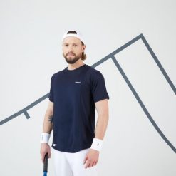 Koszulka tenisowa męska krótki rękaw Artengo Dry Gaël Monfils. Niebieskie koszulki sportowe męskie ARTENGO, l, bez wzorów, z elastanu, bez kołnierzyka, bez ramiączek, tenisowe. Za 69.99 zł.