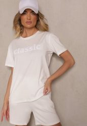 Biały Bawełniany T-shirt Zdobiony Napisem z Cyrkonii Deleire. Białe bluzki damskie Renee, l, z aplikacjami, z bawełny, eleganckie, bez kołnierzyka. Za 39.99 zł.