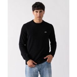 Klasyczny sweter Lacoste z czarnej bawełny organicznej. Czarne swetry przez głowę męskie Lacoste, m, bez wzorów, z bawełny, bez kołnierzyka. Za 653.40 zł.