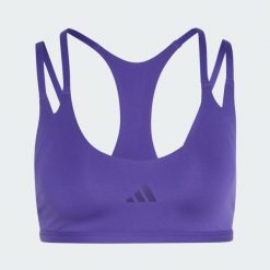Biustonosz z lekkim wsparciem do ćwiczeń Optimé z paskami z tyłu. Fioletowe biustonosze Adidas, bez wzorów, z elastanu. Za 219.00 zł.