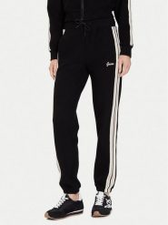 Guess Spodnie dresowe V5BB17 KCX52 Czarny Regular Fit. Czarne spodnie dresowe damskie Guess, xl, z aplikacjami, z dresówki. Za 319.99 zł.