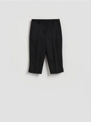 Spodnie capri - czarny. Czarne spodnie materiałowe damskie Reserved, l, bez wzorów, z bawełny. Za 109.99 zł.