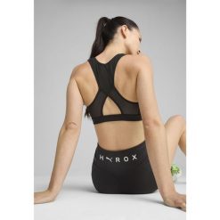 Damski stanik o średnim wsparciu PUMA × HYROX PUMA Black. Czarne biustonosze Puma, bez wzorów. W wyprzedaży za 139.00 zł.