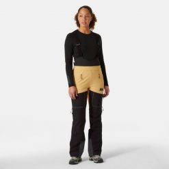 Damskie spodnie narciarskie na szelkach Helly Hansen Odin BC Softshell. Brązowe spodnie materiałowe damskie Helly Hansen, bez wzorów, z softshellu. Za 1,535.50 zł.