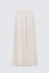 Spodnie damskie dresowe z szeroką nogawką kremowe Lunarap 102. Białe spodnie dresowe damskie Big Star, l, bez wzorów, z dresówki. Za 179.99 zł.