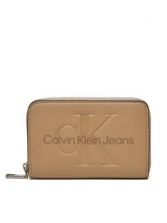 Calvin Klein Jeans Portfel Zip Around Mono K60K612255 Beżowy. Brązowe portfele damskie Calvin Klein Jeans, bez wzorów, z jeansu. Za 139.99 zł.
