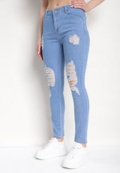 Niebieskie Dopasowane Jeansy Push-Up z Przetarciami i Regularnym Stanem Delosia. Niebieskie jeansy damskie Born2be. Za 54.99 zł.