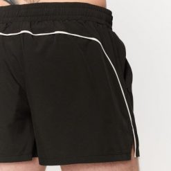 Szorty męskie fitness oversize czarne Varsity. Czarne krótkie spodenki sportowe męskie GYMBEAM, m, bez wzorów, z bawełny, na fitness i siłownię. Za 88.90 zł.