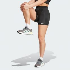 Legginsy Own the Run Short. Czarne legginsy damskie Adidas, bez wzorów, z materiału, krótkie, do biegania. W wyprzedaży za 170.82 zł.
