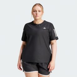 Koszulka Own The Run (Plus Size). Czarne obuwie sportowe damskie Adidas, bez wzorów, z materiału, do biegania. W wyprzedaży za 104.30 zł.