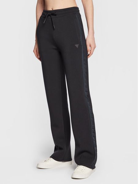 Guess Spodnie dresowe V3RB21 K7UW2 Granatowy Regular Fit. Niebieskie spodnie dresowe damskie Guess, xxs, z aplikacjami, z dresówki. Za 199.99 zł.