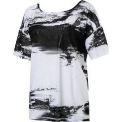 Puma Koszulka damska Dancer Drapey Tee czarno biała r. S (515721 07). Bluzki damskie marki Puma. Za 112.82 zł.