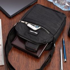 Torba na ramię męska saszetka listonoszka raportówka czarna lekka pojemna GR-7405. Czarne saszetki męskie bez wzorów, na ramię. Za 54.99 zł.