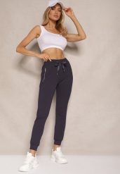 Granatowe Spodnie Dresowe z Bawełny o Kroju Jogger High Waist Cherisa. Niebieskie spodnie dresowe damskie Renee, s, bez wzorów, z bawełny. Za 49.99 zł.