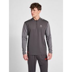 Kurtka Hummel Grid Training. Czarne bluzy męskie Hummel, xl, bez wzorów, ze skóry, bez kaptura. W wyprzedaży za 252.70 zł.
