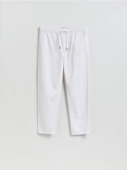 Jeansy jogger fit - biały. Białe jeansy męskie Reserved. Za 159.99 zł.