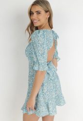 Niebieska Sukienka Clatiax. Niebieskie sukienki damskie Born2be, l, bez wzorów, z materiału, bez kołnierzyka, bez ramiączek, midi, rozkloszowane. Za 29.99 zł.
