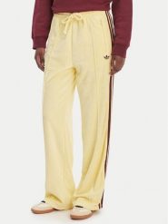 Adidas Spodnie dresowe Terry Towel Firebird KQ6662 Żółty Loose Fit. Żółte spodnie dresowe damskie Adidas, l, bez wzorów, z bawełny. Za 349.99 zł.