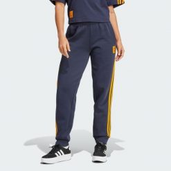 Spodnie Real Madrid Doubleknit. Niebieskie spodnie sportowe damskie Adidas, s, bez wzorów, outdoorowe. W wyprzedaży za 260.30 zł.