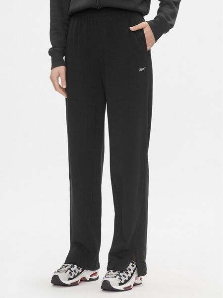 Reebok Spodnie dresowe Classics IL4647 Czarny Relaxed Fit. Czarne spodnie dresowe damskie Reebok, xl, bez wzorów, z bawełny. Za 159.99 zł.