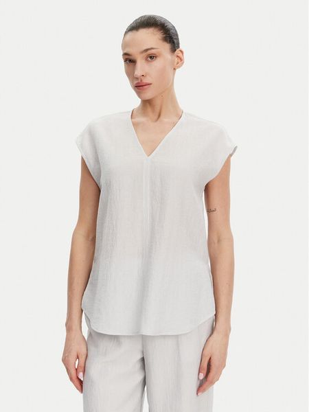 Calvin Klein Bluzka K20K208210 Błękitny Regular Fit. Niebieskie bluzki damskie Calvin Klein, bez wzorów, z lyocellu, bez kołnierzyka, bez ramiączek. Za 279.99 zł.