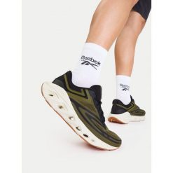 Buty do biegania Reebok. Brązowe buty sportowe męskie Reebok, bez zapięcia, do biegania. Za 349.99 zł.
