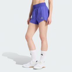 Szorty Racer Pacer z tkaniny plecionej. Fioletowe szorty damskie Adidas, l, bez wzorów, z elastanu, klasyczne, z podwyższonym stanem. Za 179.00 zł.