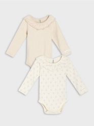 Bawełniane body z falbanami 2 pack - kremowy. Białe body niemowlęce Sinsay, bez wzorów, z bawełny, bez ramiączek. Za 22.99 zł.