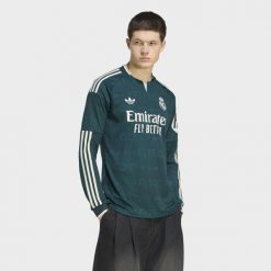 Wyjazdowa koszulka z długimi rękawami Real Madryt 26/27. Zielone koszulki sportowe męskie Adidas, s, bez wzorów, z dzianiny, bez kołnierzyka, bez ramiączek, do piłki nożnej, climacool (adidas). Za 479.00 zł.