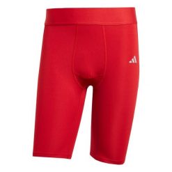 Szorty adidas Techfit. Czerwone szorty męskie Adidas, bez wzorów, z materiału. Za 90.99 zł.