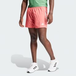 Szorty Own The Run. Czerwone krótkie spodenki sportowe męskie Adidas, bez wzorów, z materiału, do biegania. W wyprzedaży za 155.95 zł.