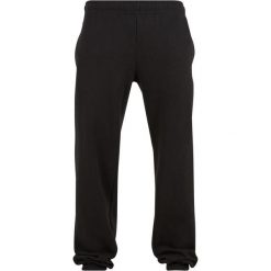 Luźne spodnie dresowe basic Urban Classics. Czarne spodnie sportowe męskie Urban Classics, s, bez wzorów, z dresówki, na fitness i siłownię. Za 127.20 zł.