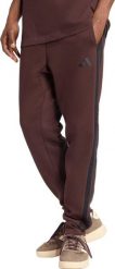 Spodnie męskie adidas Essentials 3-Stripes Fleece brązowe JX0749 M. Brązowe spodnie sportowe męskie Adidas, m, bez wzorów. Za 331.31 zł.