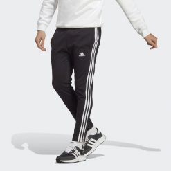 Essentials Single Jersey Tapered Open Hem 3-Stripes Pants. Białe spodnie sportowe męskie Adidas, s, bez wzorów, z dresówki, na fitness i siłownię. Za 159.00 zł.