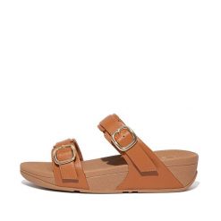 Kobiece klapki na koturnie FitFlop Lulu. Brązowe klapki damskie FIT FLOP, bez wzorów, eleganckie, bez obcasa, na koturnie. Za 565.50 zł.