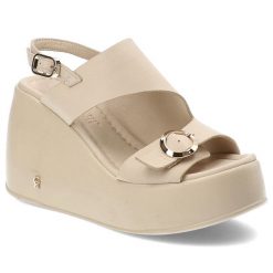 Beżowe Sandały Carinii Eleganckie Obuwie Damskie. Brązowe klapki damskie Carinii, bez wzorów, ze skóry, bez obcasa, na koturnie, bez zapięcia. Za 359.00 zł.