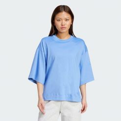 Luźna koszulka Soft Lux. Niebieskie obuwie sportowe damskie Adidas, bez wzorów, na fitness i siłownię. Za 199.00 zł.