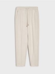 Spodnie cygaretki z dzianiny scuba - kremowy. Białe spodnie materiałowe damskie Sinsay, l, bez wzorów, z dzianiny. Za 49.99 zł.