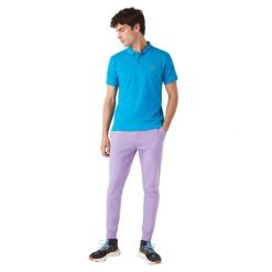 Spodnie turystyczne męskie Lacoste. Fioletowe spodnie sportowe męskie Lacoste, na lato, m, z aplikacjami, z dresówki, trekkingowe. Za 317.00 zł.