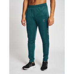 Spodnie dresowe polyesterowe Hummel Core XK. Zielone krótkie spodenki sportowe męskie Hummel, na jesień, m, bez wzorów, z dresówki, na fitness i siłownię. Za 203.50 zł.