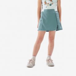 Spódnico-spodenki turystyczne dla dziewczynek MH100. Niebieskie spodenki dla dziewczynek QUECHUA, bez wzorów, z elastanu, sportowe. Za 44.99 zł.