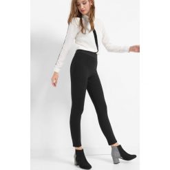 Tregginsy z wysokim stanem. Czarne legginsy damskie Orsay, z elastanu. Za 79.99 zł.
