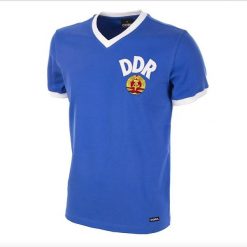 Koszulka retro dla dorosłych - Mistrzostwa Świata DDR 1974 - Niebieska. Niebieskie koszulki sportowe męskie COPA FOOTBALL, s, bez wzorów, bez kołnierzyka, bez ramiączek, do piłki nożnej. Za 254.34 zł.