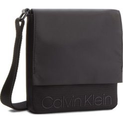 Saszetka CALVIN KLEIN - Shadow Reporter With K50K503913 001. Saszetki męskie marki Calvin Klein. W wyprzedaży za 239.00 zł.