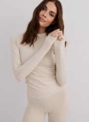 Damski top odprowadzający wilgoć, 4‑kierunkowo elastyczny Baselayer beżowy. Białe bielizna termoaktywna damska Aim'n, s, bez wzorów, z elastanu, bez ramiączek, długie. Za 215.00 zł.