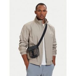 Saszetka Calvin Klein. Brązowe saszetki męskie Calvin Klein, młodzieżowe, małe. Za 329.99 zł.